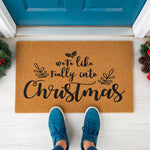 a door mat that says we're like really into christmas