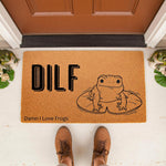 Funny frog doormat with DILF Damn I Love Frogs text and a cute toad illustration on a natural coir welcome mat, perfect for a porch entrance or front door decor for animal lovers who enjoy humorous home accessories and quirky