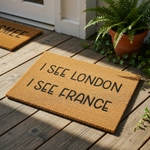 Funny doormat with the phrase I See London I See France printed in black text on a natural coir fiber welcome mat, perfect for a humorous front porch entrance or a quirky housewarming gift for a new home or apartment entryway.