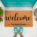 Personalized family name welcome doormat made of natural coir fiber, featuring a stylish script font design for a front porch entry, perfect as a custom housewarming decor piece for your home entrance and outdoor floor mat