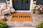 Funny Bye Felicia doormat for front porch, featuring a natural coir fiber welcome mat with bold black text and polka dot accents, displayed on a stone entryway floor in a cozy outdoor home decor setting for a stylish house