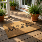 Funny dog lover doormat with the text Hope You Brought Beer and Dog Treats printed in black on a natural coir fiber welcome mat, perfect for a front porch entry or as a humorous housewarming gift for pet owners and beer