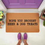 Funny dog lover doormat with text Hope You Brought Beer and Dog Treats, a natural coir fiber welcome mat for front porch decor, featuring a humorous message for guests and pet owners in a stylish outdoor entryway setting.