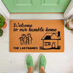 Personalized family welcome doormat with stick figure illustration and house design on natural coir fiber, featuring custom last name text for a front porch entry rug that adds a warm touch to your home decor and entryway.