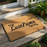 Personalized family name coir doormat featuring custom text in a stylish script font, this durable natural fiber welcome mat is a functional housewarming decor piece for your front porch entry or home entrance floor.