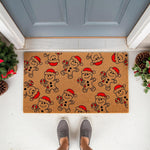Gingerbread man Christmas doormat featuring a festive pattern of cookies wearing Santa hats and holding candy canes, this natural coir welcome mat adds holiday cheer to your front porch decor for the winter season and home