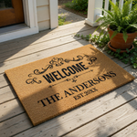 Personalized family name welcome doormat featuring a classic scroll design on natural coir fiber, this custom outdoor entry rug makes a housewarming front porch mat for any home entrance with a custom last name and established