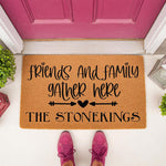 Personalized family name doormat featuring the phrase friends and family gather here on natural coir fiber, a durable outdoor welcome mat for front porch decor that makes a custom housewarming gift for any new home entryway.