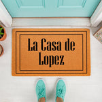 Personalized family name doormat featuring a custom text design on a durable coir welcome mat, perfect for a front porch entry.