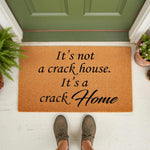 Funny doormat with humorous text on a natural coir fiber welcome mat, featuring a witty quote about a crack home for your front porch decor, perfect for a housewarming entrance or a sarcastic home entryway floor mat design.
