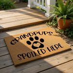 Grandpups Spoiled Here coir doormat featuring a black paw print with a heart center, this funny pet lover welcome mat is a durable outdoor rug for dog owners and a cute housewarming gift for any proud grandparent of fur babies.