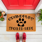 Grandpups Spoiled Here doormat featuring a paw print with a heart center, this natural coir fiber welcome mat is a funny dog lover porch decor piece for grandparents who love their grandpups and want a cute pet themed entryway