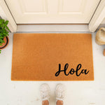 Hola coir doormat for front porch entry, featuring natural fiber construction with black script text, this stylish welcome mat adds a friendly touch to your home decor and serves as a durable outdoor floor rug for guests.
