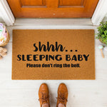 a door mat that says skinny sleeping baby please don't bring the hell
