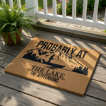 Personalized lake house doormat featuring a mountain and fishing boat design, this custom coir welcome mat is a durable outdoor floor rug for cabin decor, lake life enthusiasts, and family home entryways with a custom last name.