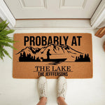 Personalized fishing lake doormat featuring a mountain and boat silhouette, this custom outdoor welcome mat for home entryways is a durable coir rug that makes a fun housewarming decor piece for any outdoor living space.
