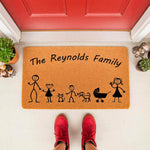 Personalized family stick figure doormat with cat and dog icons, featuring a custom last name on a natural coir welcome mat for front porch decor, creating a fun and inviting entrance for any home with kids and pets.
