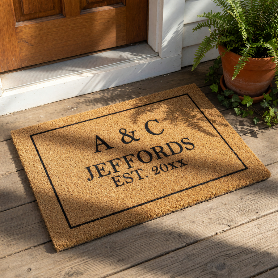 Personalized family name doormat featuring a classic border design on natural coir fiber, this custom welcome mat is a durable outdoor floor rug for your front porch entry that makes a thoughtful housewarming or wedding