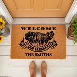 Personalized farmhouse cow welcome doormat featuring a rustic barn and cattle illustration on natural coir fiber, perfect for a custom family name front porch entry mat that adds a charming country touch to your home decor.
