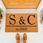 Personalized couple doormat with custom initials and established year, featuring a durable natural coir welcome mat design for front porch decor, perfect for a new home housewarming or wedding anniversary entrance floor mat.