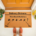 Funny doormat for delivery drivers featuring a pop culture trivia question about a famous television couple on a break, printed on a natural coir welcome mat for front porch decor that adds a humorous touch to your home entryway.