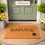 Funny dog doormat with the text all guests must be approved by the dog and a black paw print, this natural coir fiber welcome mat is a cute pet lover front porch decor piece for dog owners who want a humorous outdoor entryway rug.