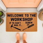Funny Workshop Doormat with a hammer and screwdriver design, featuring the text Welcome to the Workshop if ya can't nail it screw it, this natural coir fiber welcome mat is a humorous front porch decor for a garage or handyman.