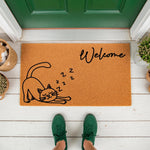 Sleeping cat welcome doormat featuring a cute feline illustration on natural coir fiber, this funny pet lover entry rug adds charm to any front porch decor while greeting guests with a whimsical design on a durable outdoor floor
