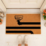 Dachshund welcome doormat featuring a long dog silhouette with a speech bubble on a natural coir fiber mat, perfect for a front porch entry way, dog lover home decor, or a funny pet themed outdoor floor rug for your front door.