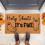 Funny ghost fall doormat with the text Holy Sheet It is Fall, featuring a natural coir welcome mat for front porch decor, perfect for autumn home entryways with cute ghost illustrations and seasonal pumpkin accents for a festive