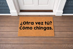 Funny Spanish doormat with rude text on a front porch, featuring a natural coir fiber welcome mat that says Otra vez tu Como chingas, perfect for a sarcastic home entrance decor or a humorous housewarming gift for friends and
