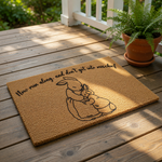 Coir doormat featuring a line art illustration of a mother rabbit hugging her baby, with the text Now run along and don't get into mischief printed above, perfect as a whimsical outdoor welcome mat or front porch floor decor.