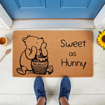 Sweet as Hunny coir doormat featuring a cute cartoon bear eating from a honey pot, this natural fiber welcome mat is a charming front porch decor piece for any home entrance, adding a whimsical touch to your outdoor entryway
