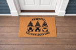 Happy Thanksgiving gnome doormat featuring three cute gnomes with pumpkins and turkey on a natural coir welcome mat, perfect for fall porch decor and autumn home entryways to greet guests during the holiday season with festive