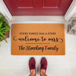 Personalized family name doormat featuring the text Every Family Has A Story Welcome To Ours on a natural coir fiber mat, perfect for a front porch entryway decor update with a stylish custom last name design for a housewarming