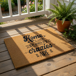 Home is where my bunch of crazies are doormat, a funny coir welcome mat for front porch decor featuring bold black typography on a natural fiber rug, perfect for a humorous housewarming entry way or a quirky family home door mat.