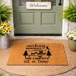 Camping themed welcome doormat featuring a travel trailer, pine trees, and the text making memories one campsite at a time, this natural coir fiber outdoor rug is a stylish addition to any porch or front door entryway for camping