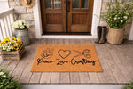 Peace Love Crafting doormat featuring a natural coir fiber welcome mat with black ink icons of a peace sign, heart, and scissors, displayed on a rustic front porch for a creative home entrance decor look that crafters will love.