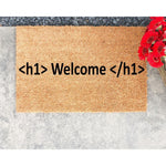 Coder welcome doormat featuring HTML tag text on natural coir fiber, this funny front porch mat is a unique housewarming decor piece for programmers and tech enthusiasts looking for a durable outdoor entrance rug for their home.