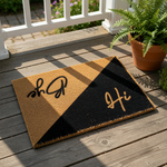 Hi Bye doormat featuring a split design with natural coir fiber and a black painted section, this funny front porch welcome mat uses modern script lettering to greet guests and say goodbye at your home entrance or apartment door.