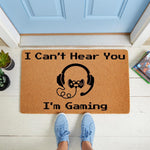 Gaming doormat with I Can't Hear You I'm Gaming text and a controller headset graphic, this funny gamer welcome mat is a durable coir floor rug for a front porch or entryway, perfect for video game lovers and home decor