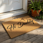 Hi Daddy coir doormat for front porch entry, featuring a natural fiber welcome mat with black script text, a durable outdoor floor rug, and a funny housewarming entrance decor piece for a father or new dad home entryway.