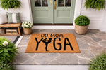 Do More Yoga doormat featuring a silhouette of a person in a yoga pose on a natural coir welcome mat, perfect for a front porch entrance, home decor, or a housewarming gift for yoga lovers and fitness enthusiasts.