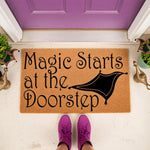 Magic Starts at the Doorstep coir doormat featuring a flying carpet graphic, this natural fiber welcome mat is a fun fantasy home decor piece for your front porch entrance, perfect for fans of magical stories and whimsical house