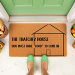 Personalized family name coir doormat featuring a house outline and funny food quote, perfect for a front porch entrance.