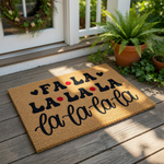Fa La La Christmas doormat featuring festive holiday lyrics in black text with red accents on a natural coir welcome mat, perfect for seasonal front porch decor and winter home entryways to greet guests with festive holiday cheer.