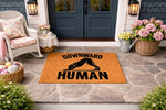 Downward Human dog yoga doormat featuring a funny canine silhouette in a stretching pose on a natural coir welcome mat, perfect for a front porch entryway, home decor, or a humorous housewarming gift for any dog lover or yoga