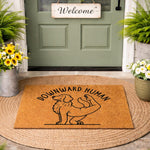 Dog yoga doormat featuring a golden retriever in a pose with the text Downward Human, this natural fiber coir welcome mat is a funny pet lover floor rug for a front porch entry, perfect for yoga enthusiasts and dog owners alike.