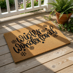 Winter Wonderland doormat featuring black script text and snowflake icons on a natural coir fiber mat, perfect for holiday porch decor, seasonal entryway rugs, and festive home entrance floor mats for the cold weather season.