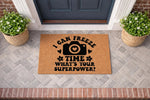 Photographer welcome doormat with a camera icon and the text I Can Freeze Time What Is Your Superpower, featuring a natural coir fiber texture on a front porch entryway for a photography lover or camera enthusiast home decor.